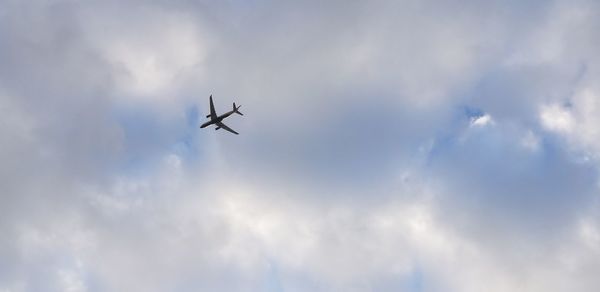 Low angle view of airplane in sky