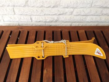 High angle view of chairs on bench