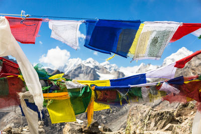 Clothes drying on clothesline against sky