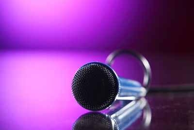 Close-up of microphone on table