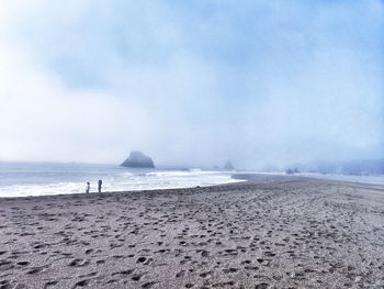 Women standing at beach