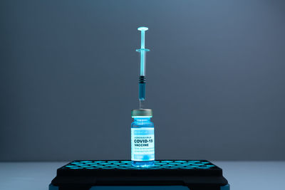 Low angle view of illuminated building against blue sky