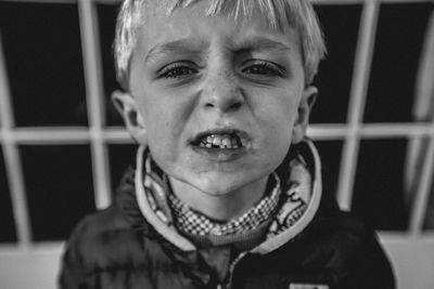 Portrait of boy clenching teeth