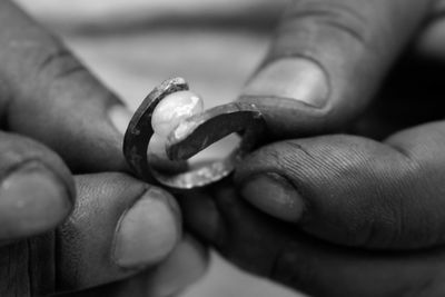 Close-up of man holding hands