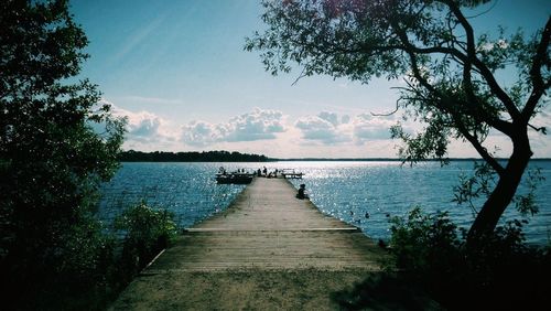 View of jetty leading to sea