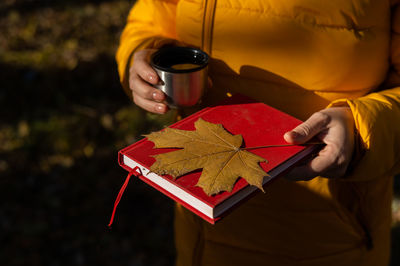 Cropped hand of woman holding gift