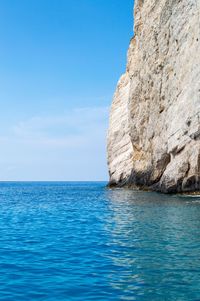 Scenic view of sea against blue sky