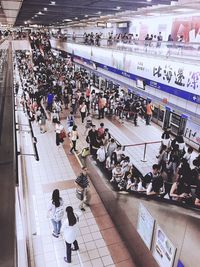 High angle view of people sitting in modern building