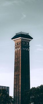 Low angle view of clock tower against sky