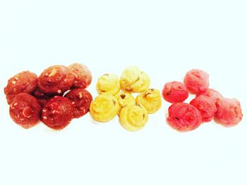 Close-up of fruits against white background