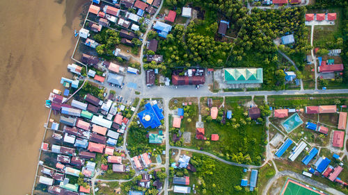 Aerial view of houses amidst trees