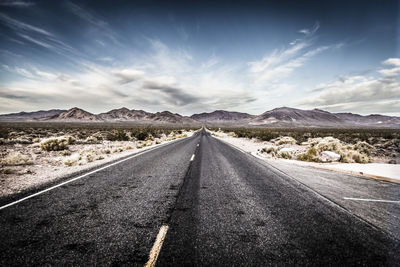 Surface level of empty road along landscape