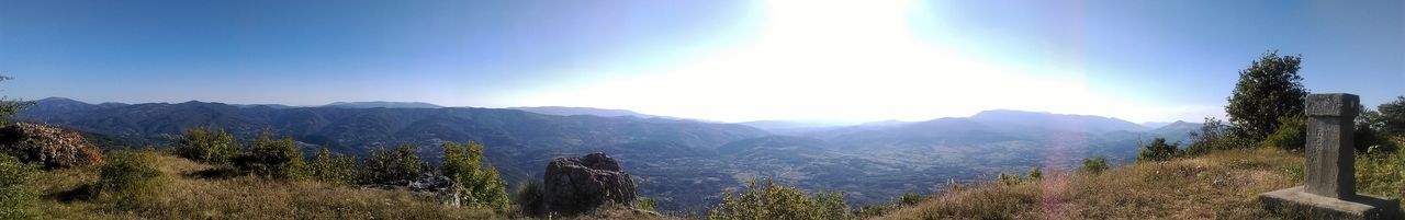 Panoramic view of mountains against clear sky