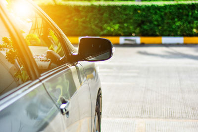 Close-up of car on road