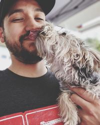 Portrait of young man with dog