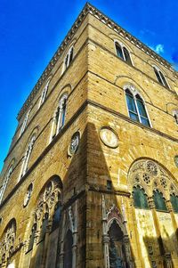 Low angle view of church against blue sky