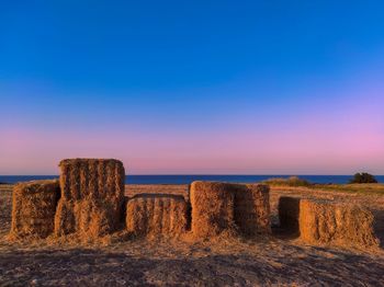 Scenic view of sea against clear sky during sunset