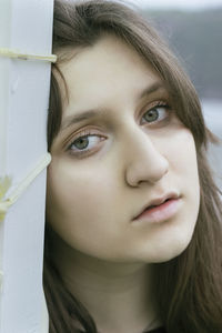 Close-up portrait of a serious young woman