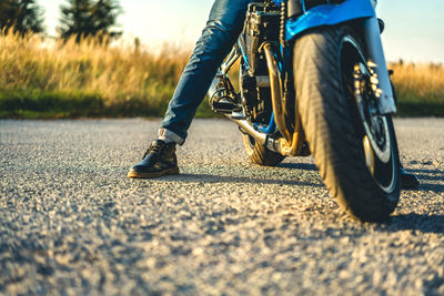 Close-up of motorcycle on road