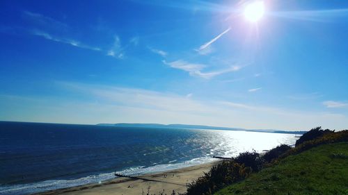 Scenic view of sea against blue sky