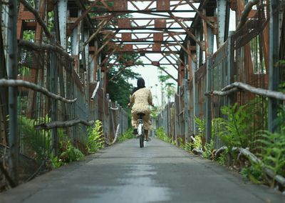 Full length of woman walking on footpath