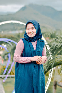 Portrait lifestyle muslim, a beautiful muslim woman smiles sweetly in front of the camera