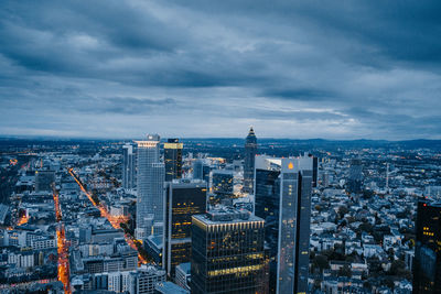 High angle view of illuminated buildings in city against sky