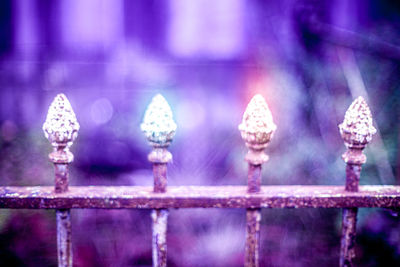 Close-up of metal fence against blurred background