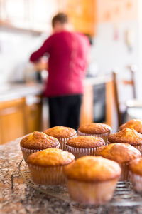 Rear view of man preparing food