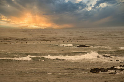 Scenic view of sea against sky during sunset