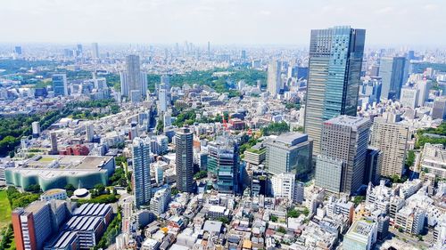 Buildings in city against sky