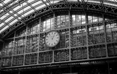 Low angle view of railroad station in building