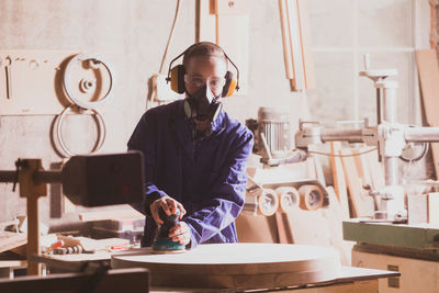 Portrait of man working on table