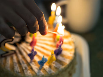 Close-up of hand holding cake