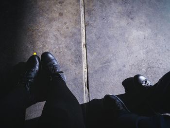 Low section of man standing on floor