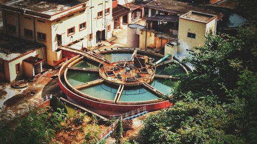 High angle view of abandoned building by trees