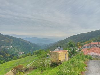 Scenic view of landscape and mountains against sky