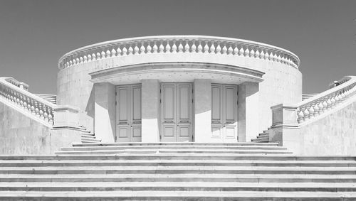 Low angle view of staircase in building against sky