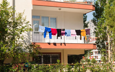 Low angle view of clothes drying against building