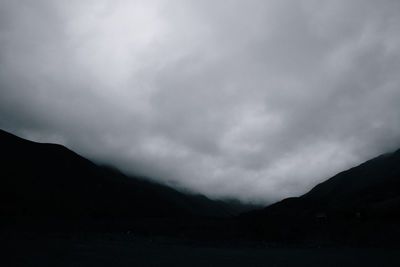 Scenic view of silhouette mountain against sky