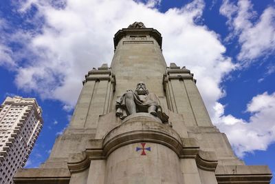 Low angle view of historical building against cloudy sky