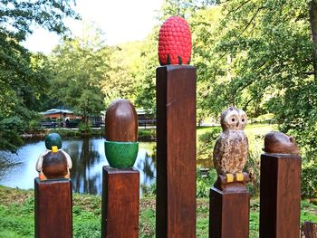 Statues on wooden post