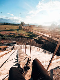 Low section of man relaxing on landscape