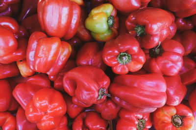 Full frame shot of red bell peppers at market stall