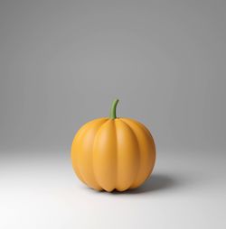 Close-up of pumpkins against white background