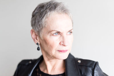 Portrait of mid adult man against white background