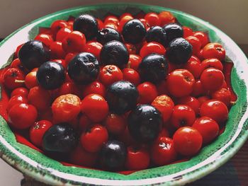 High angle view of strawberries in bowl on table