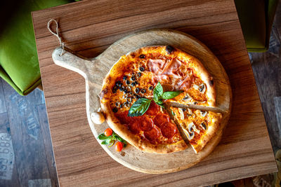 High angle view of pizza served on table