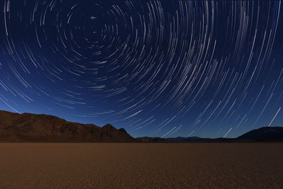 Scenic view of desert against sky at night