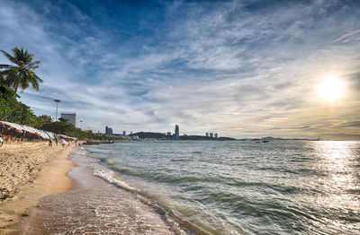 View of beach against cloudy sky